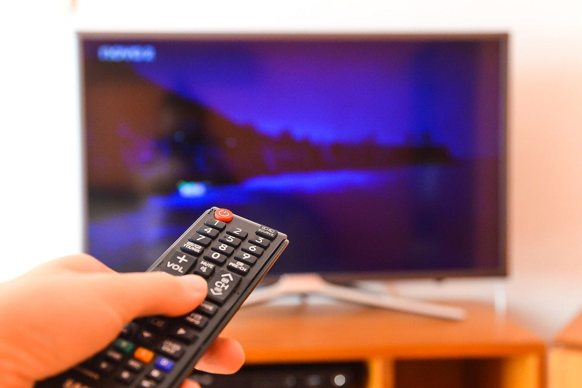 Remote pointed at a TV showing a streaming service menu